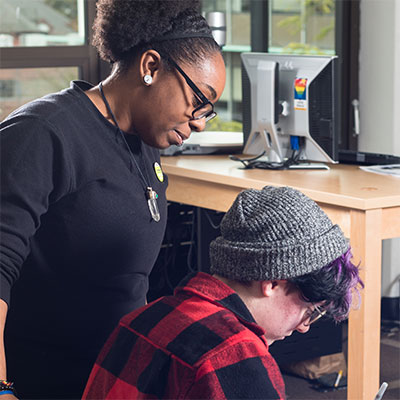 A teacher helping a student